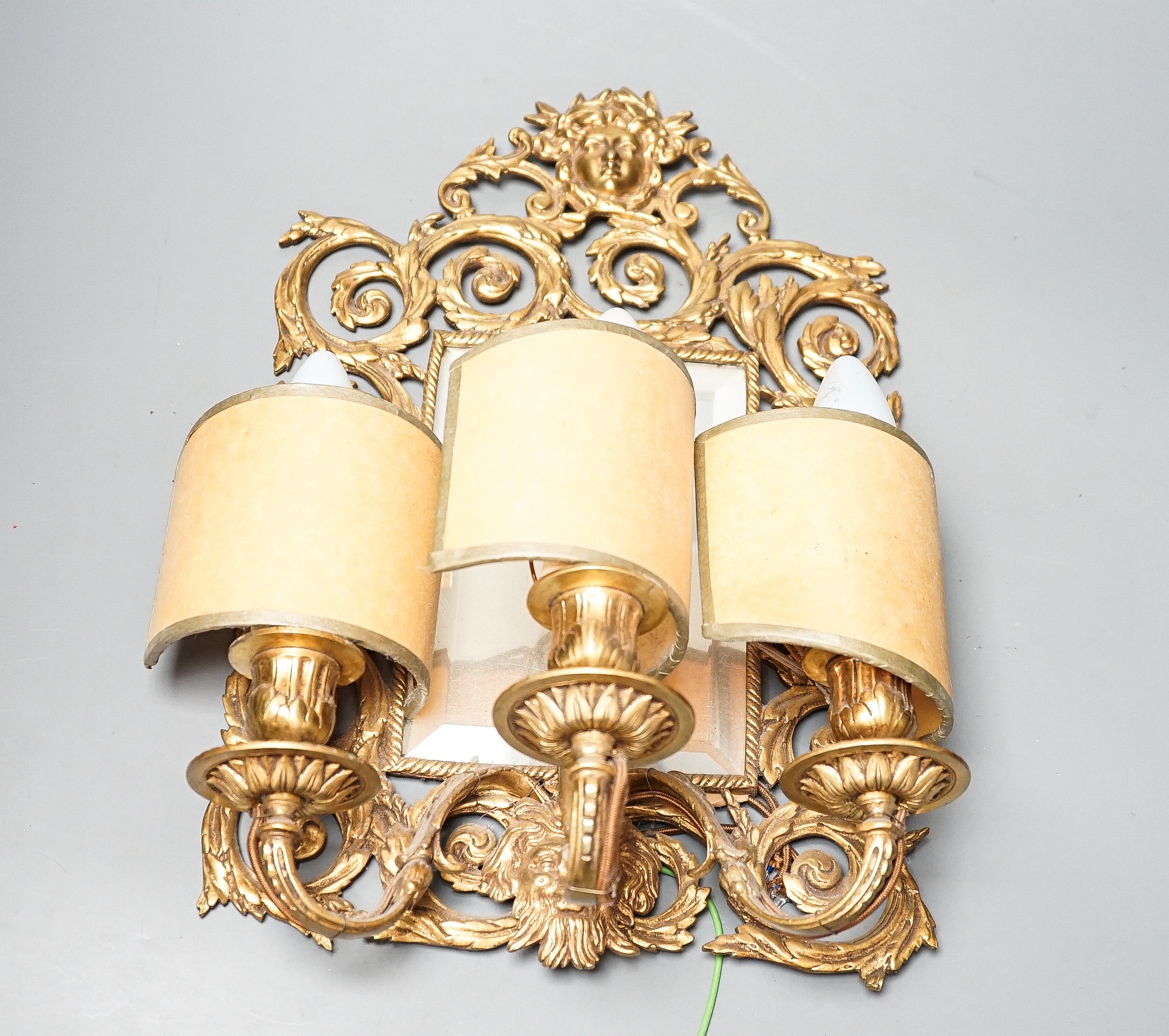 A pair of early 20th century gilt brass girandole mirrors, 39cms high.